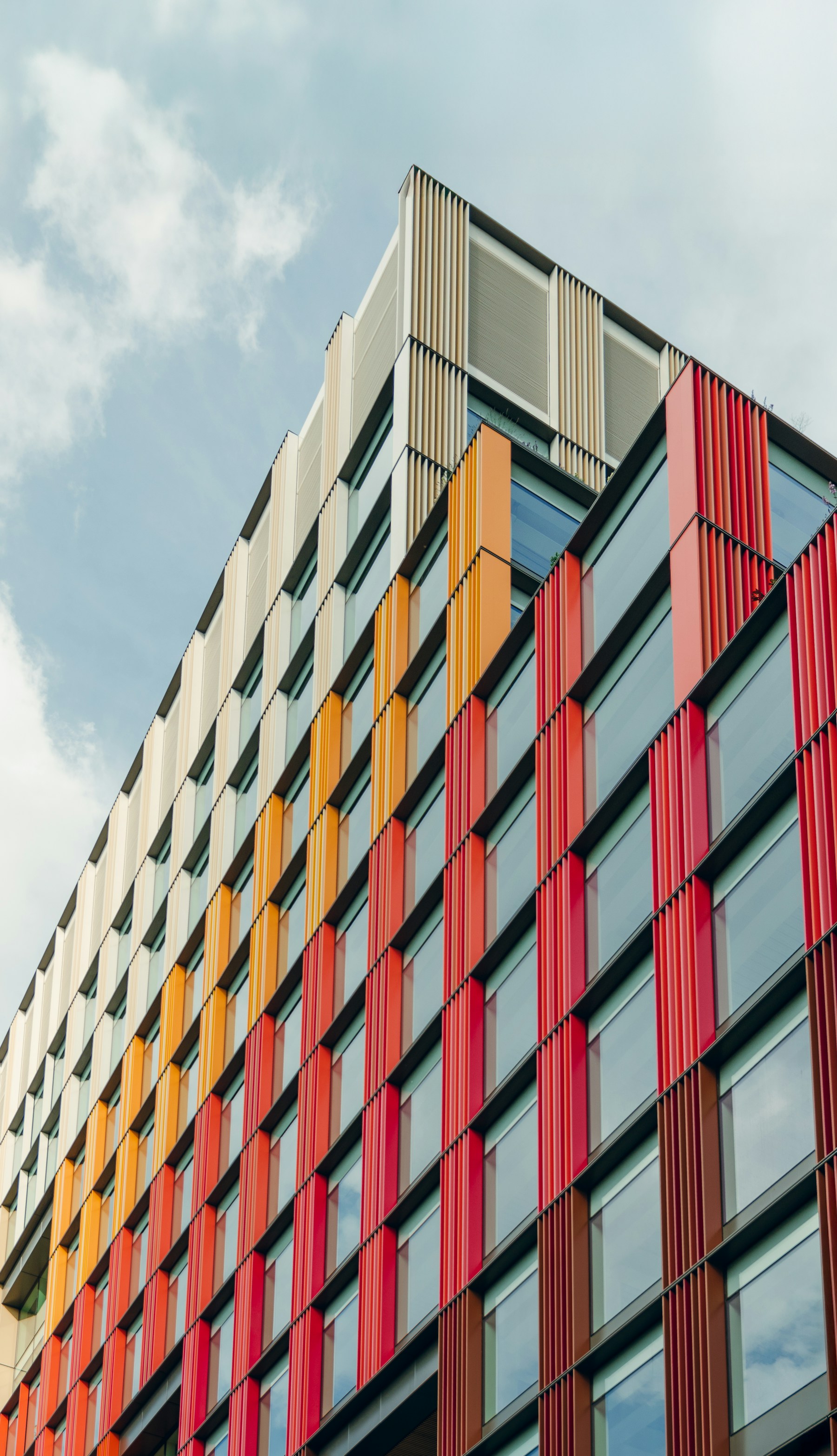 The junction of two elevations on a modern panel-clad building