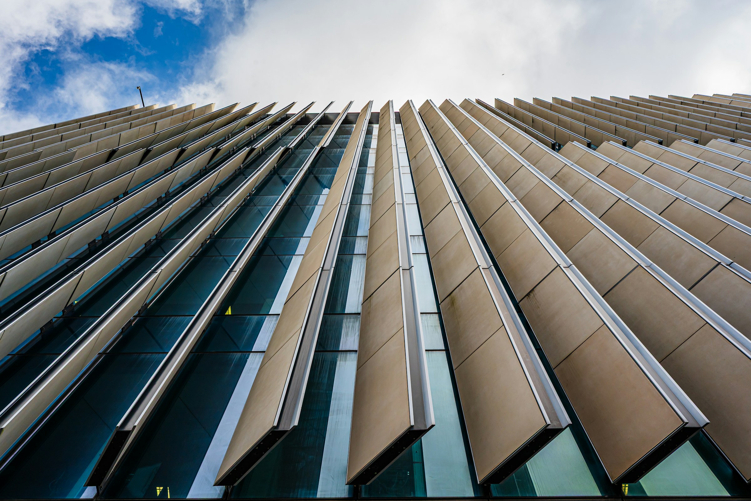 Angled cladding panels and glazing on a contemporary building